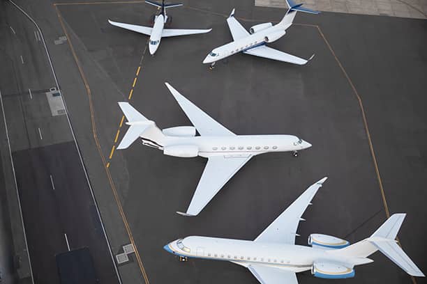 Four Full White Jets on a Runway Top View