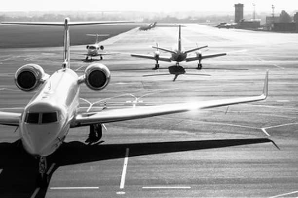 Three Plains on a Runway in Black and White Color