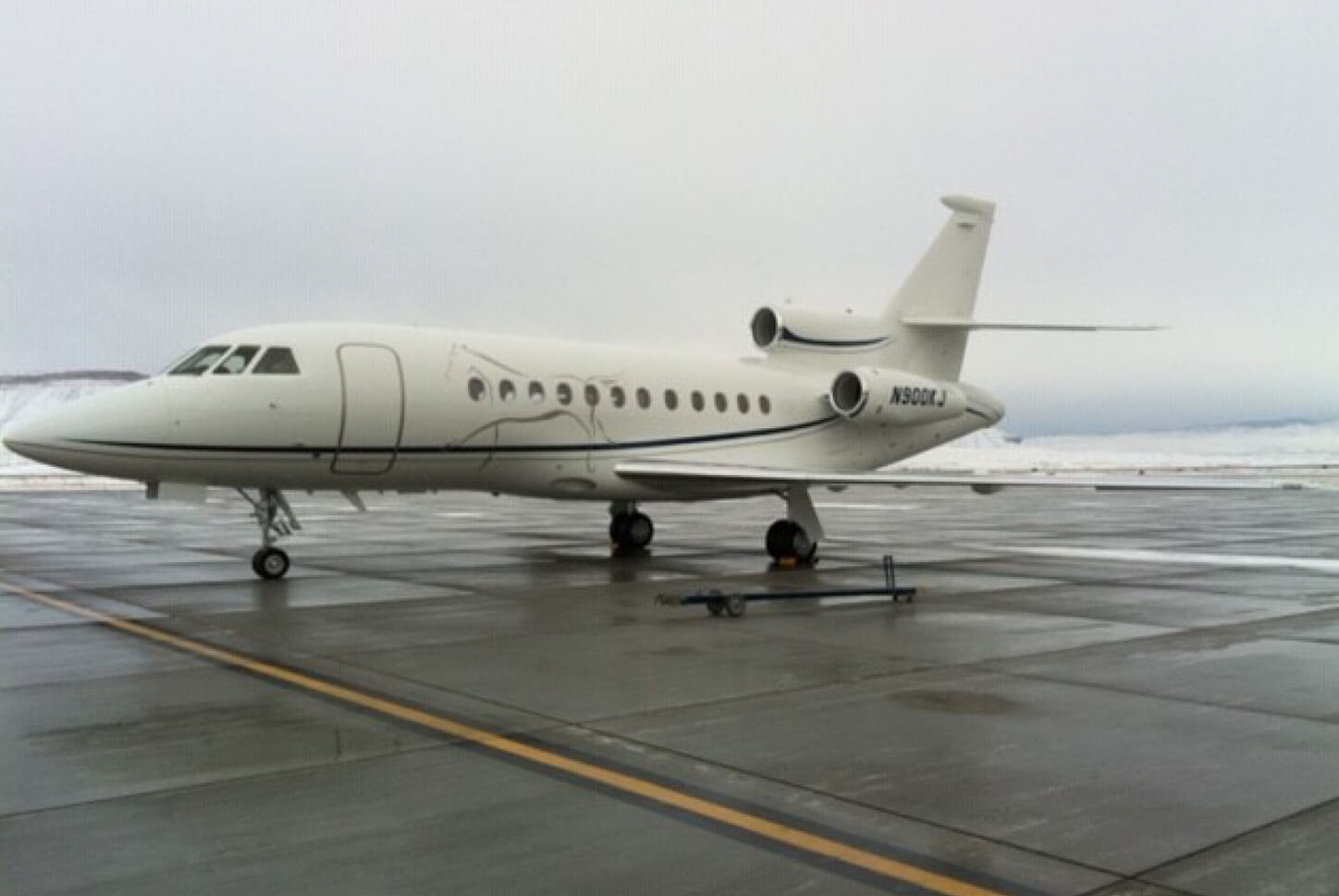 Side View Shot of a Falcon Dassault 900CSN on Runway